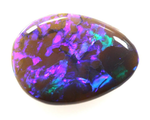 2.64 carat off tear drop shape with mauve pattern!