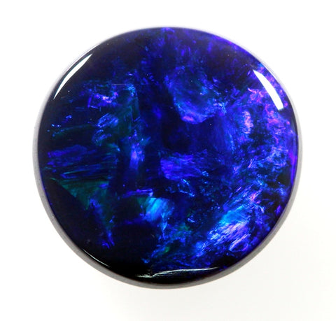 Bright Blue/green round solid black Opal!